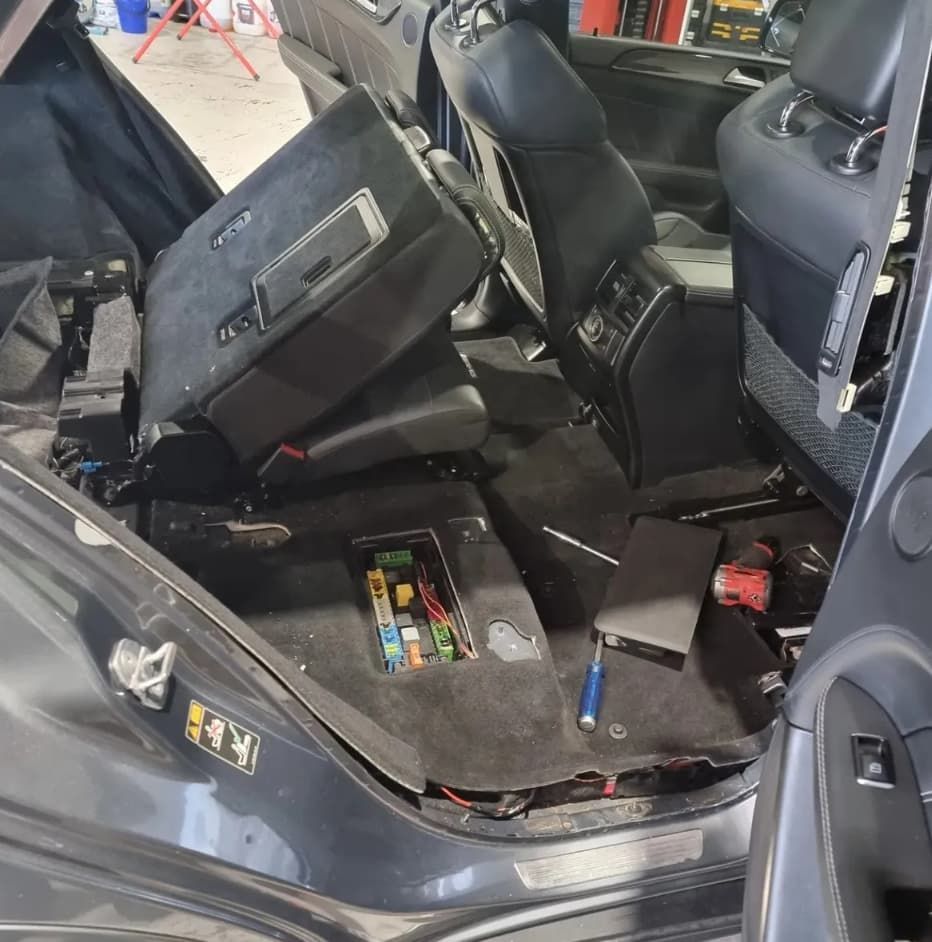 Interior Of A Car With Seats Removed, Revealing Wiring And Fuse Box — MC Automotive Service & Repairs in Maitland, NSW