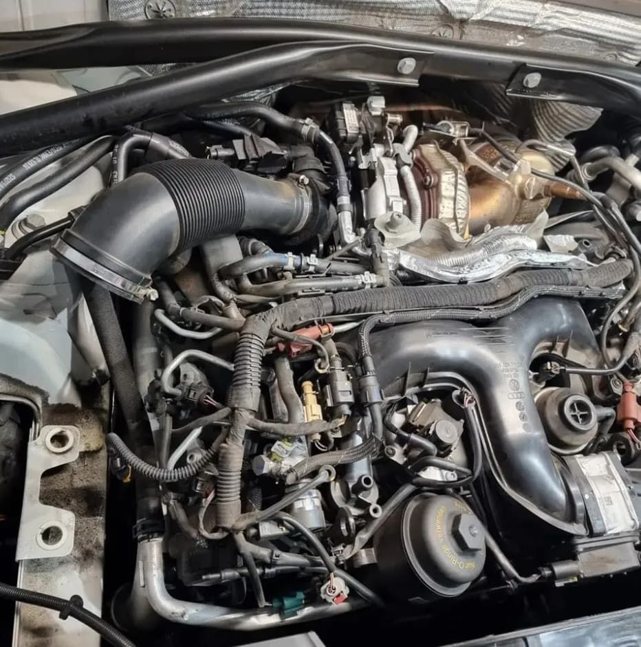 A Car Engine With Hoses And Wires Visible — MC Automotive Service & Repairs in Maitland, NSW