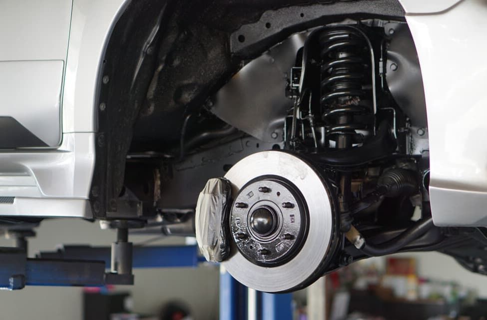 Car's Front Wheel Assembly, Exposed, Showing Brake Rotor And Caliper — MC Automotive Service & Repairs in Maitland, NSW
