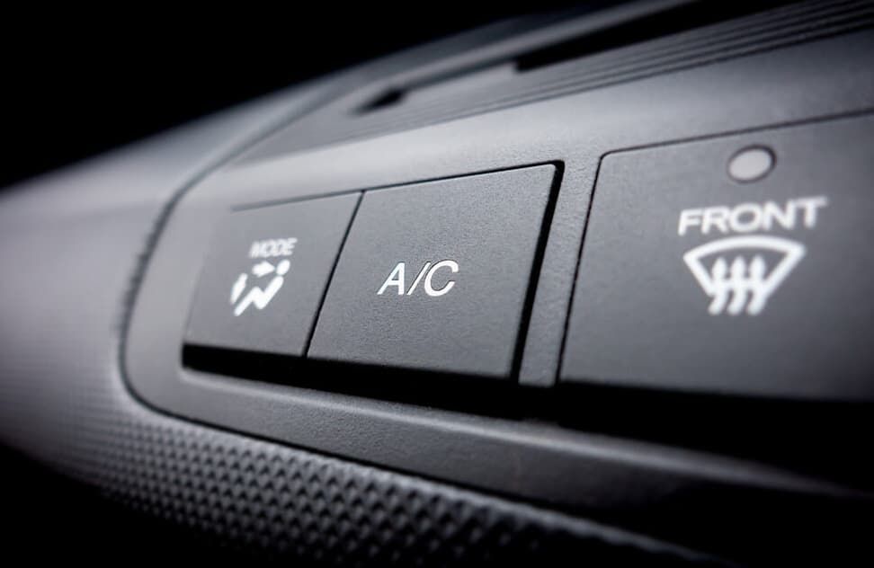 Close-up Of Black Car Aircon Buttons — MC Automotive Service & Repairs in Maitland, NSW