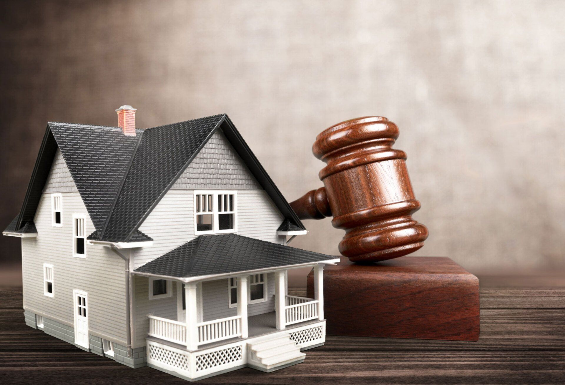 gavel and a miniature house