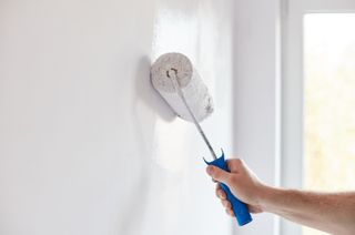 Paint roller on wall