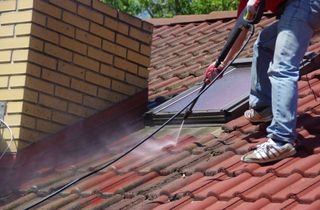 Kent Handyman cleaning rooftop