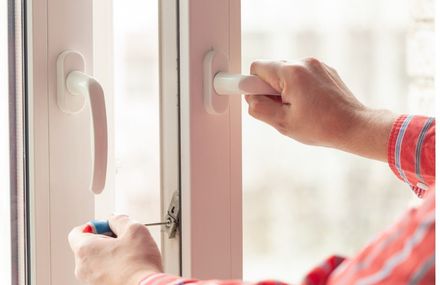 Kent Handyman installing new door hardware