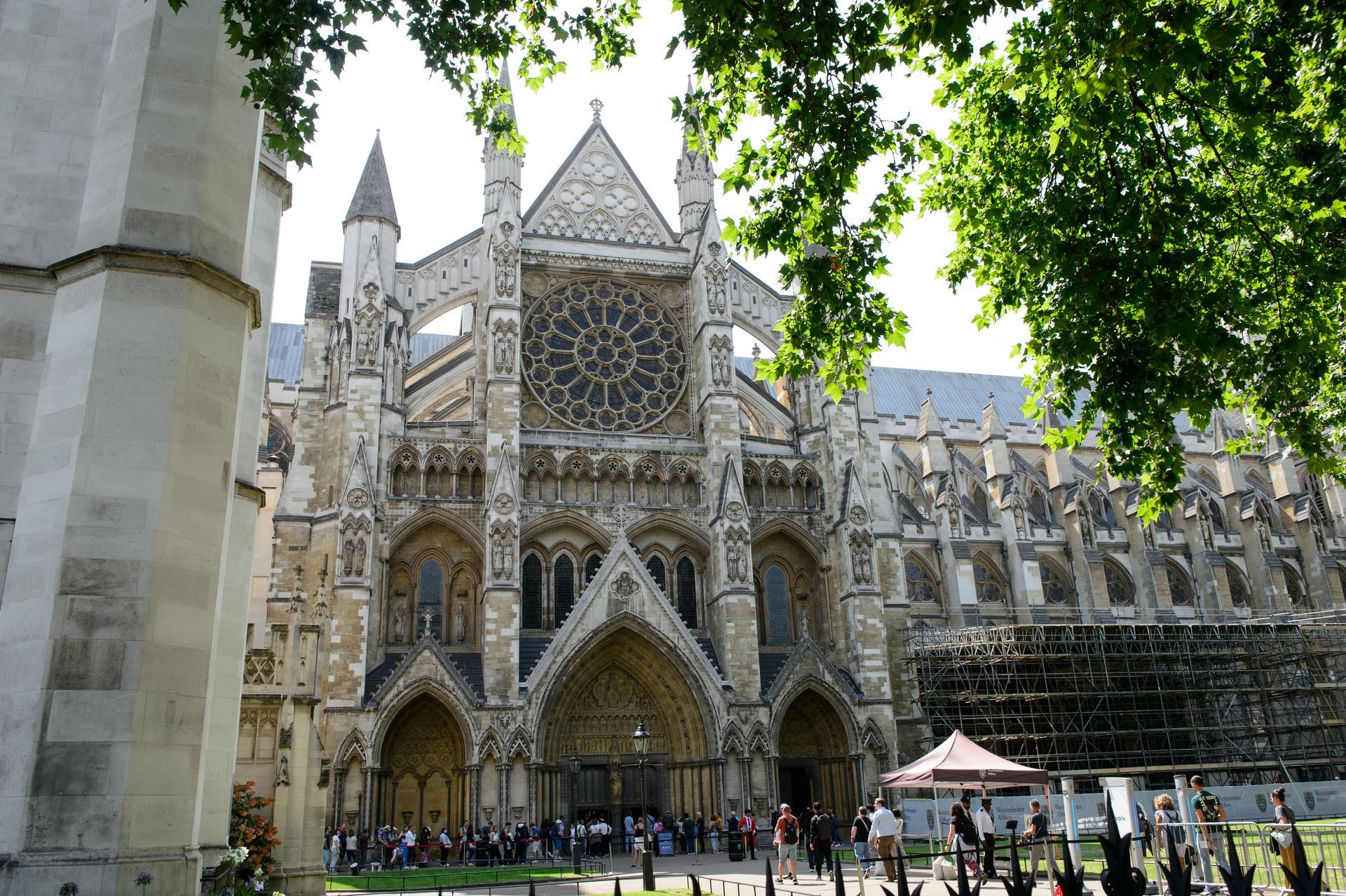 Westminster Abbey exterior with Gothic architecture framed by trees
