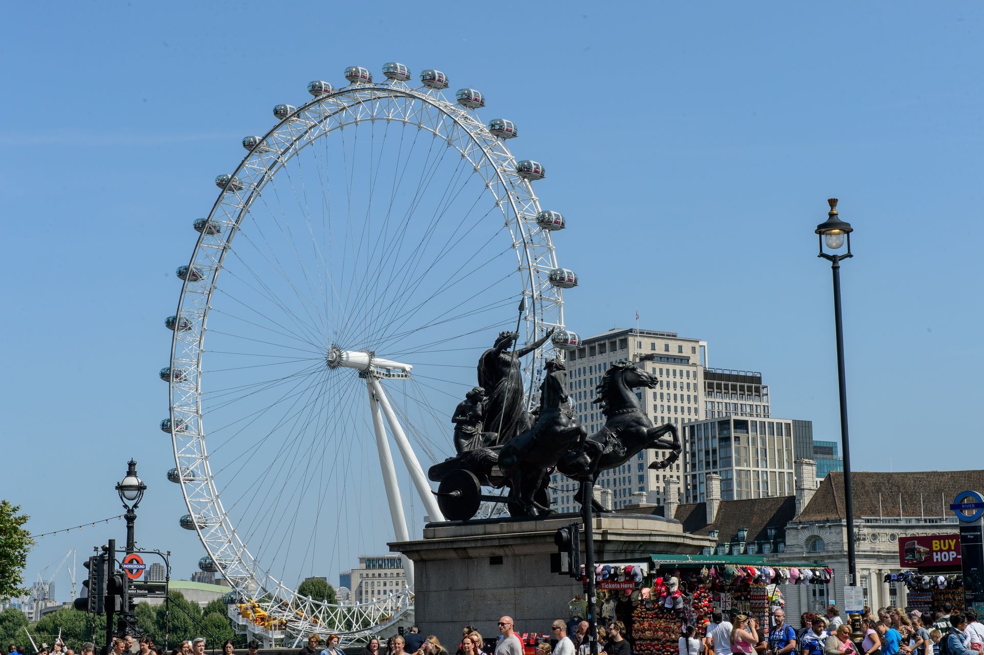 Boudica statue on Westminster Bridge with the London Eye in the background beside the River Thames