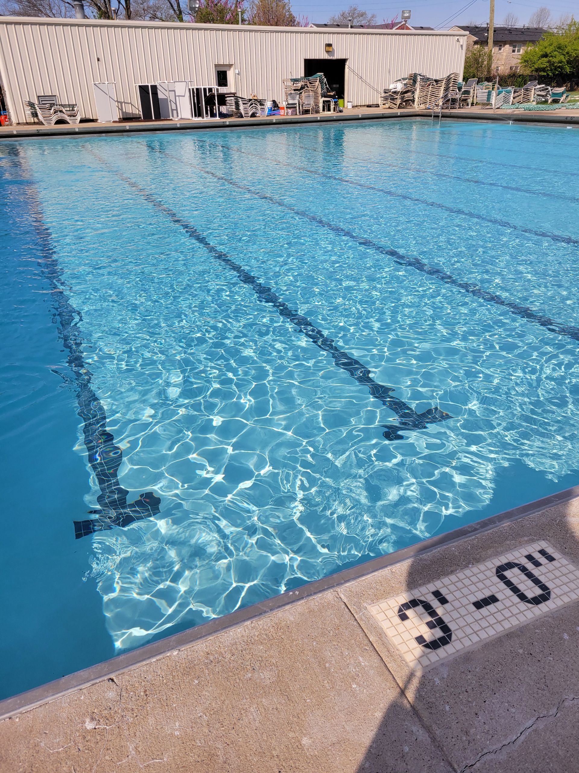 A swimming pool with the number 3 on the edge of it