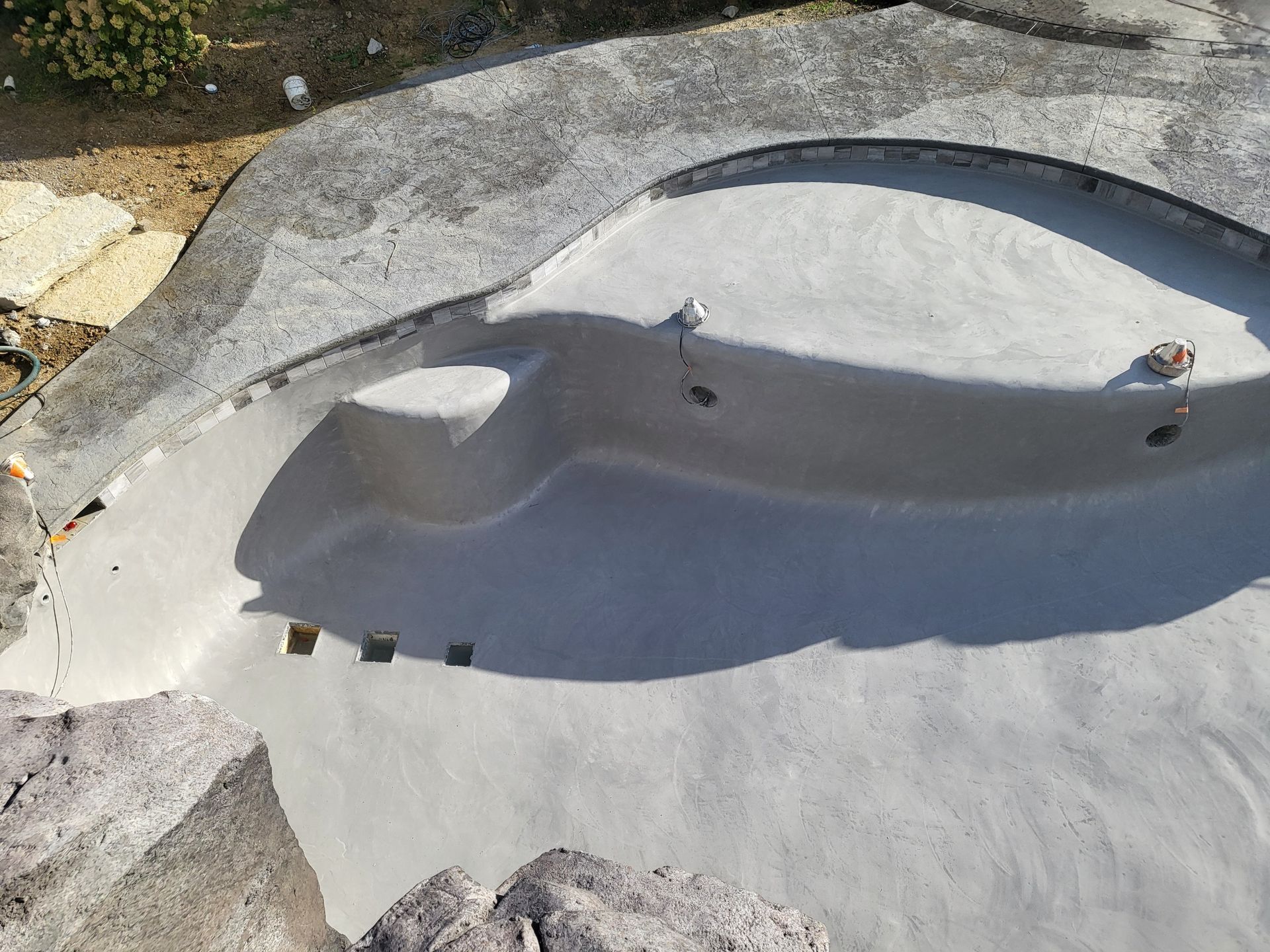 An aerial view of a swimming pool being built