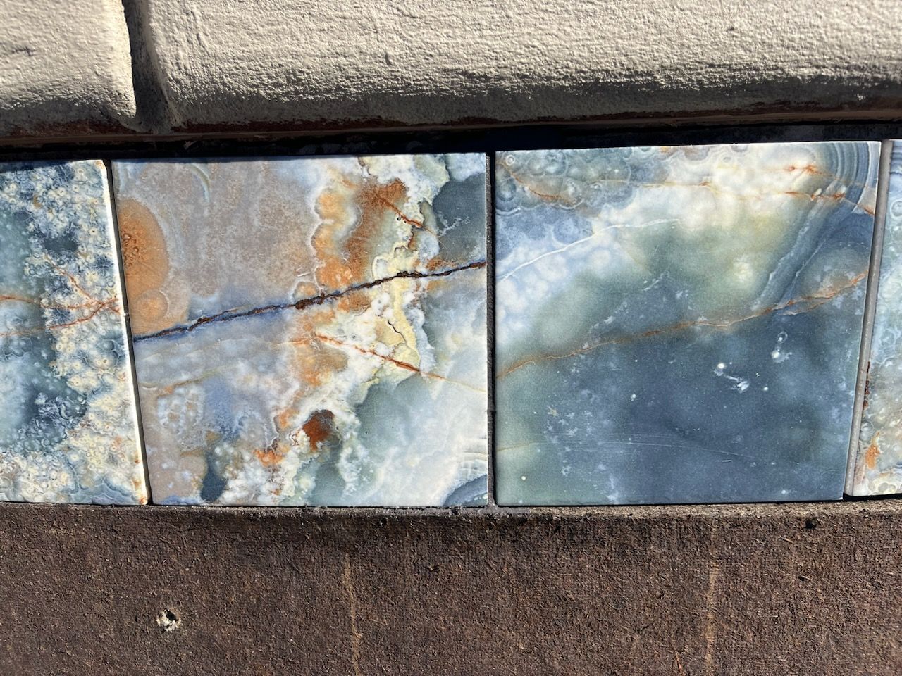 A close up of a tile that looks like marble