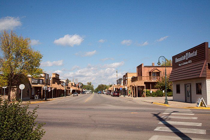 a small town with a lot of buildings on the side of the road .