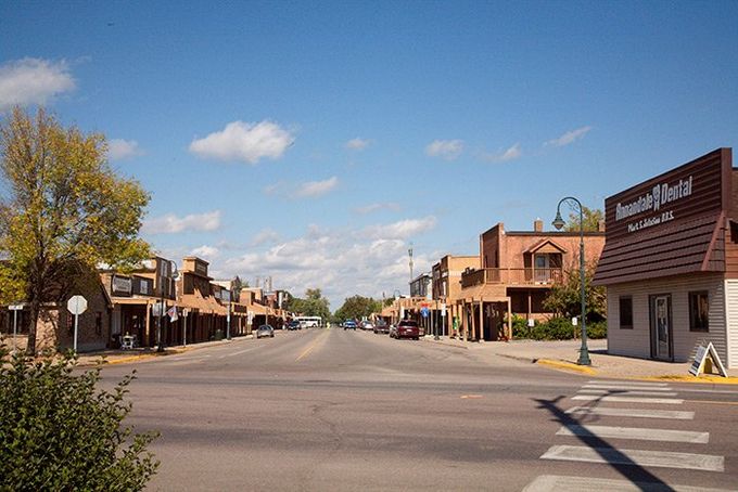 a small town with a lot of buildings on the side of the road .