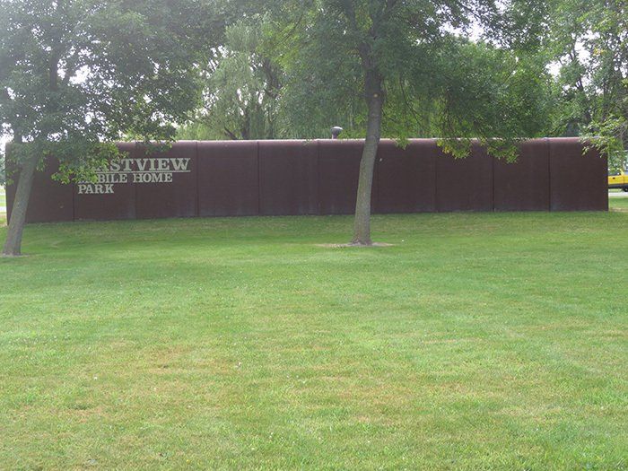 a large brown sign that says eastview free movie park