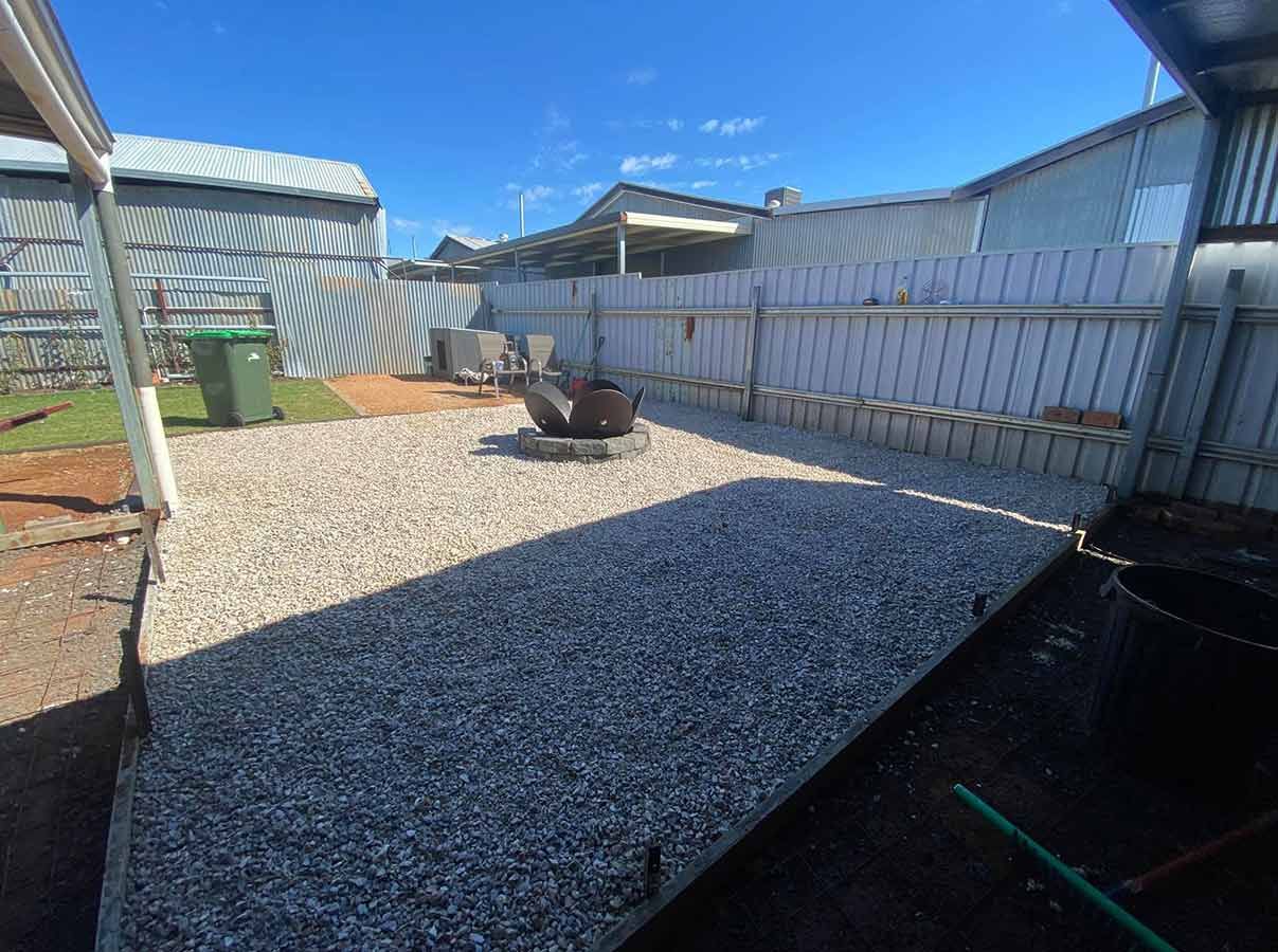 There is a Fire Pit in the Backyard of a House — B & C Yard Improvements in Forbes, NSW
