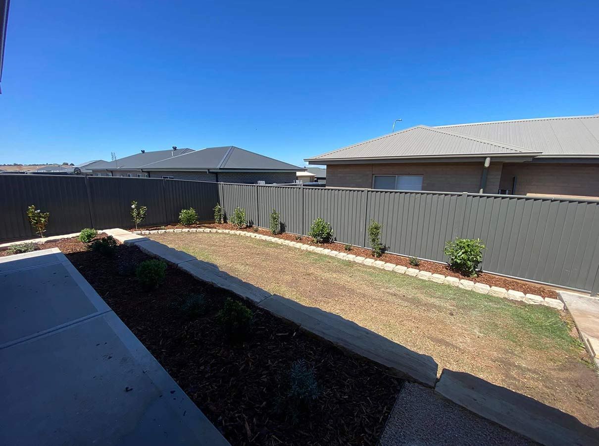 There is a Fence in the Backyard of a House — B & C Yard Improvements in Mudgee, NSW