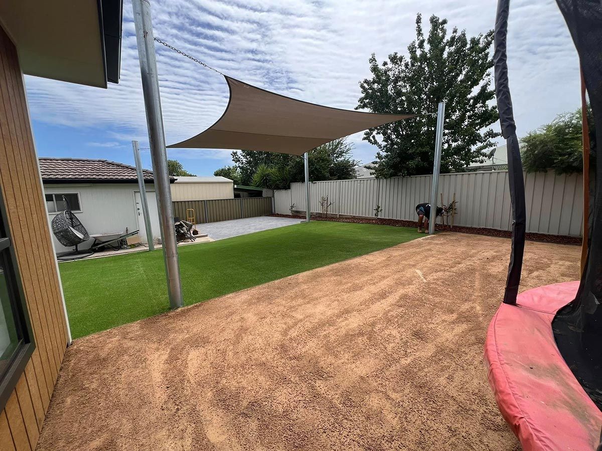 A Backyard With a Swing and a Shade Sail — B & C Yard Improvements in Orange, NSW