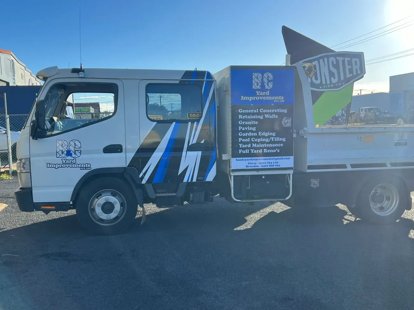 A White and Blue Truck is Parked in a Parking Lot — B & C Yard Improvements in Dubbo, NSW