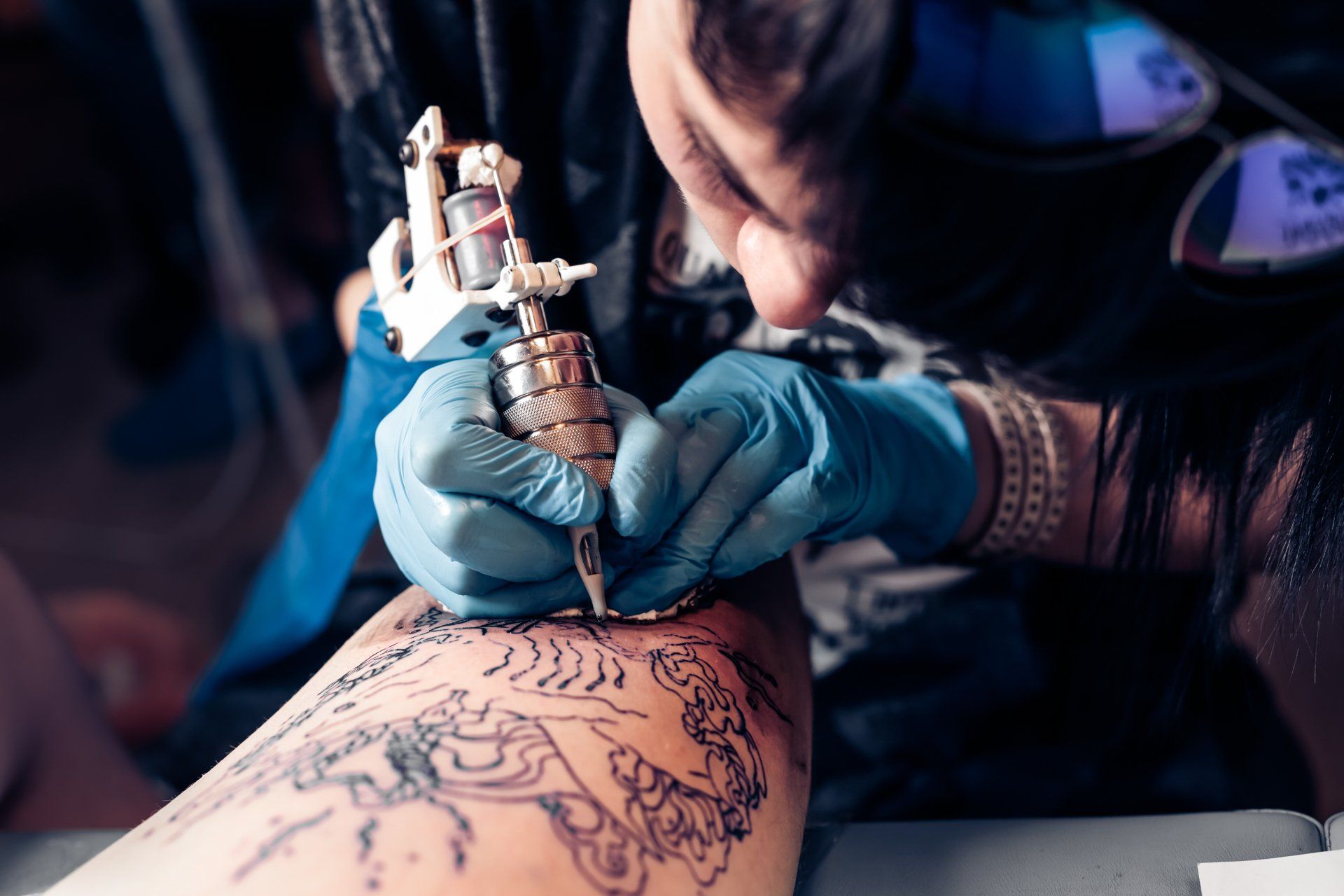 man doing tattoo