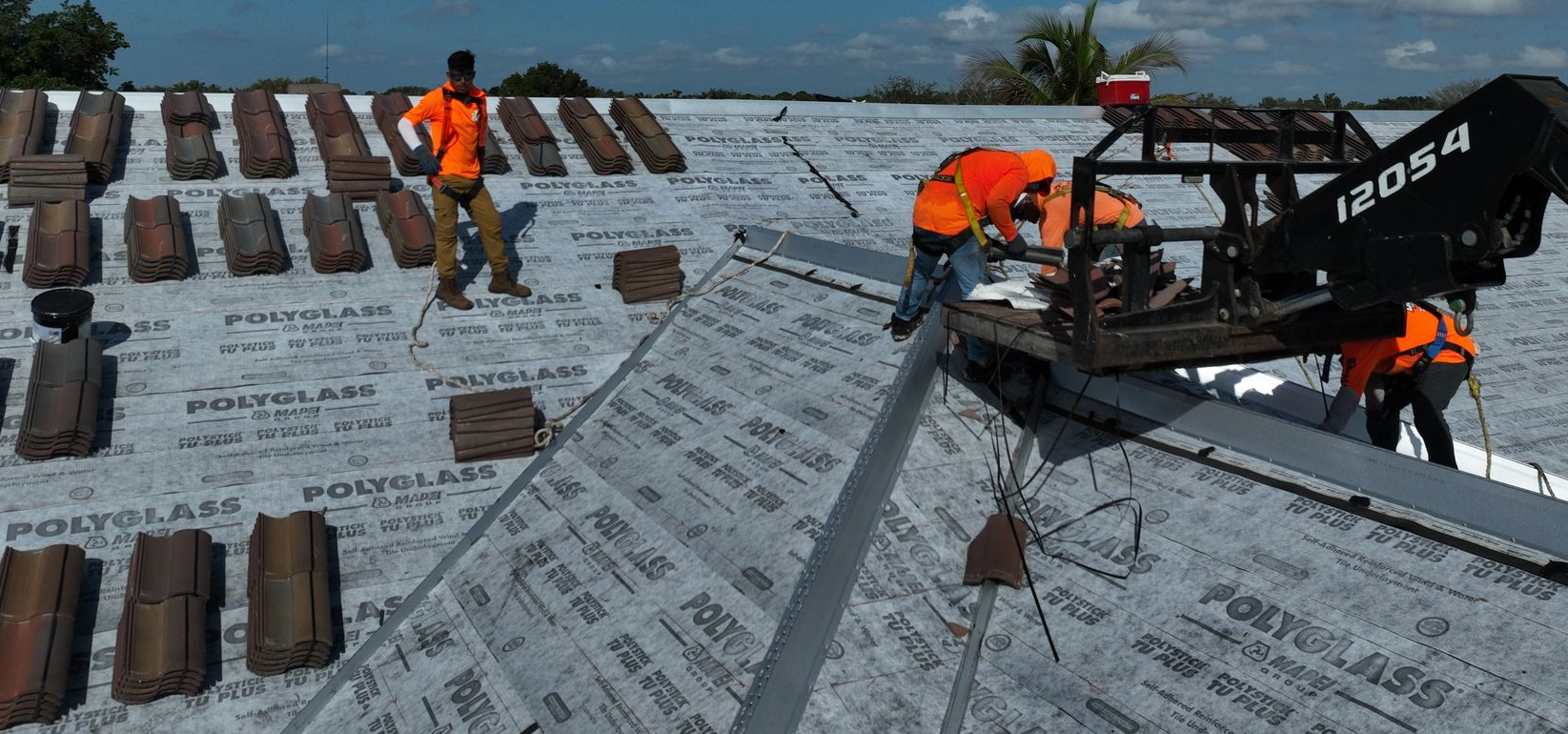 Roof tile pallets being staged and loaded at a distribution yard