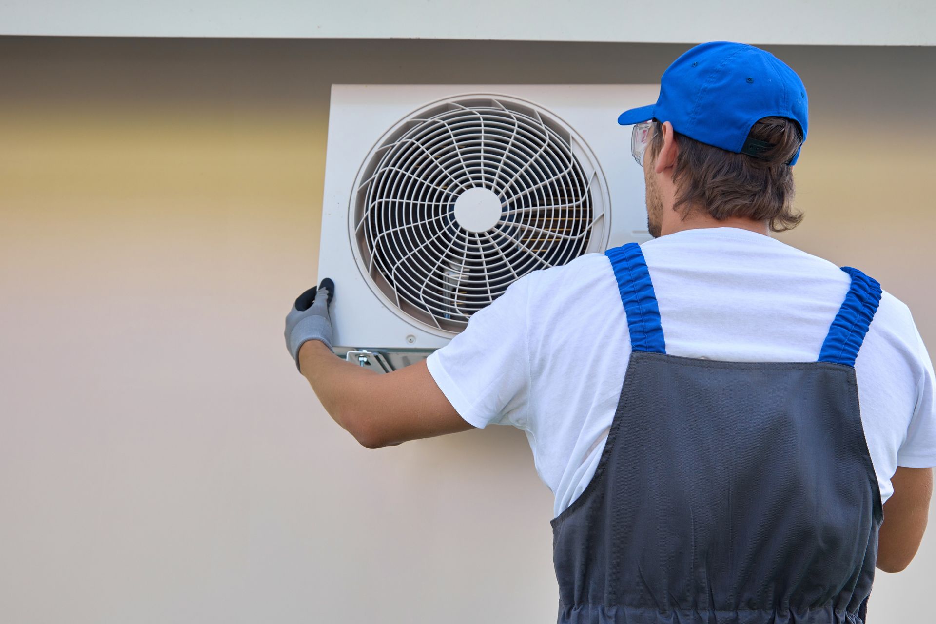 Man Installing the Air Condition