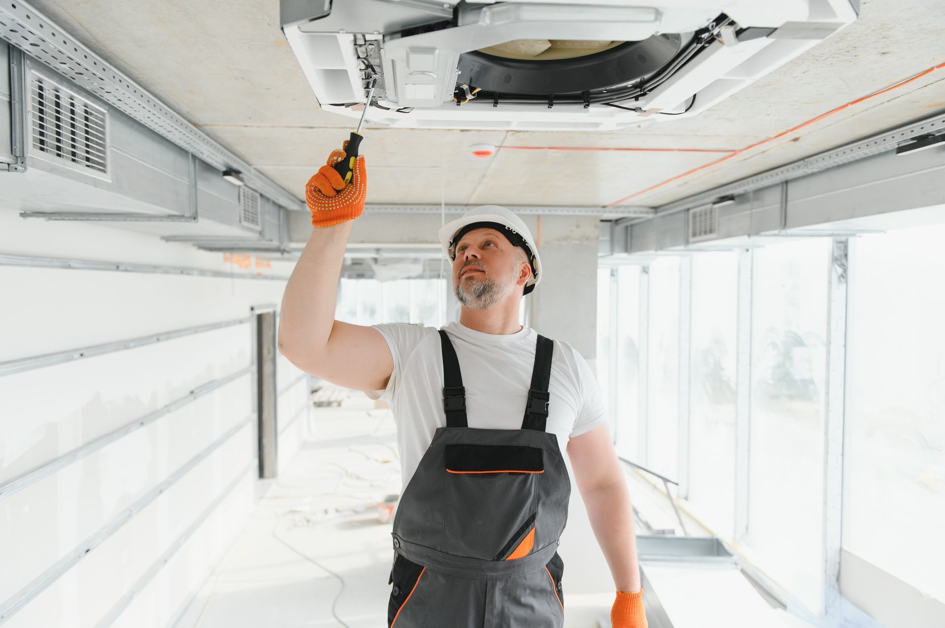 Man Checking the Air Conditioner