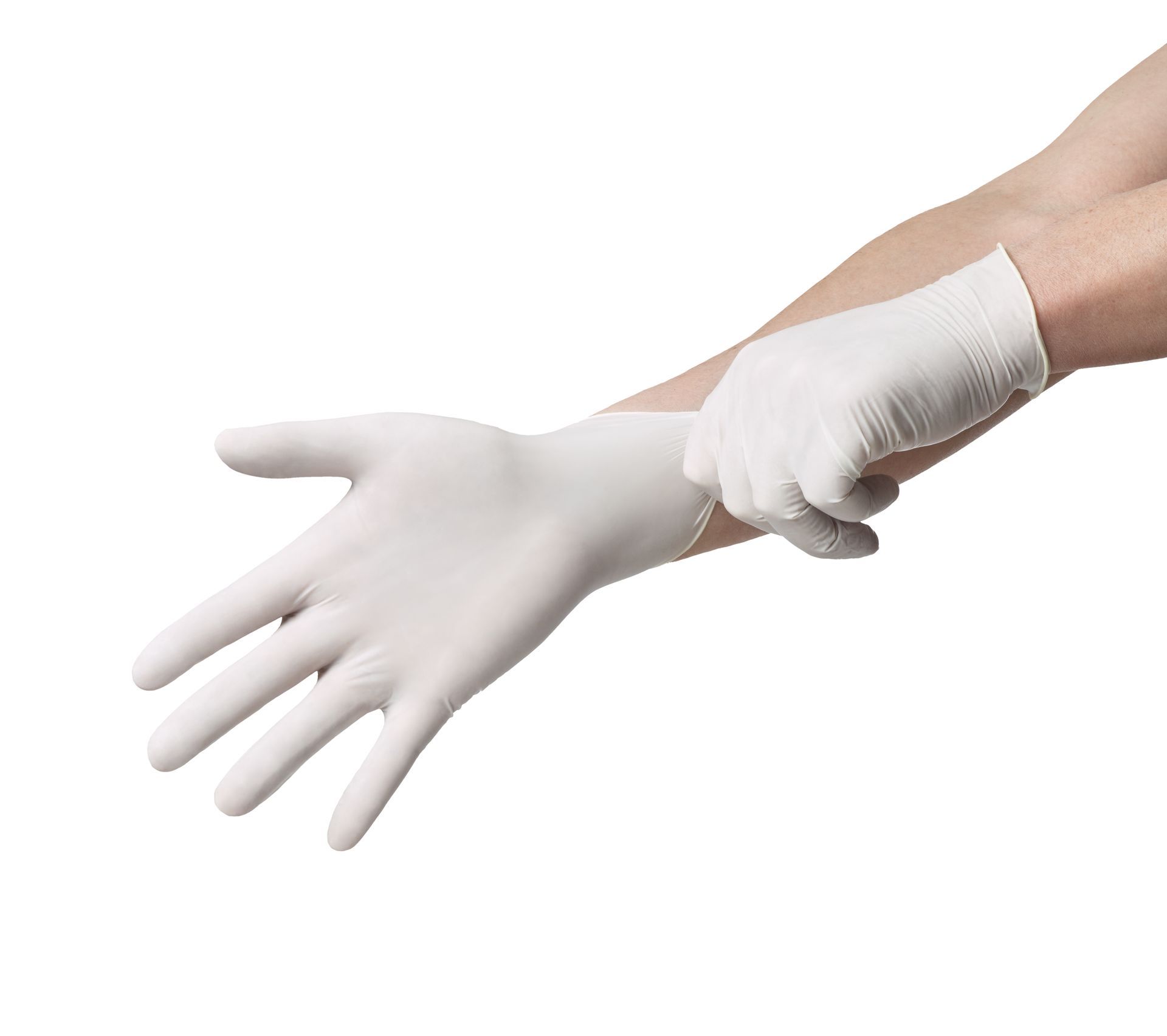 A hand wearing a white glove being pulled onto the wrist of another hand