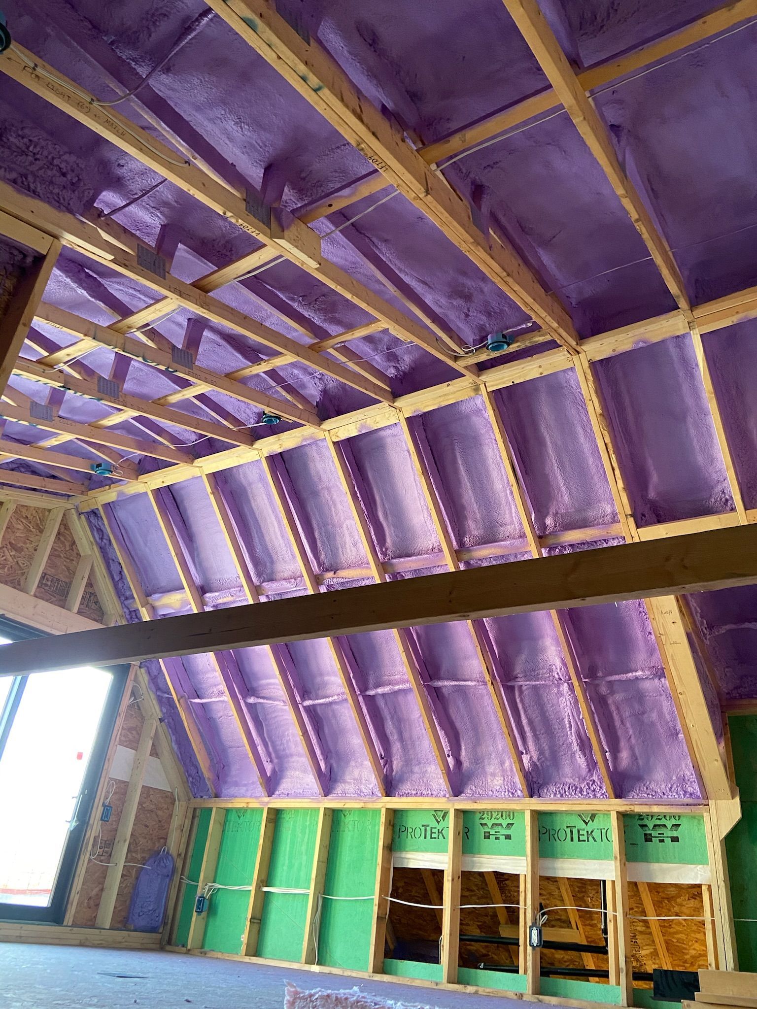 A room with a purple ceiling and green walls.