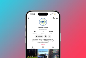Smartphone showing a TikTok profile page with a circular logo, follower stats, and video thumbnails.