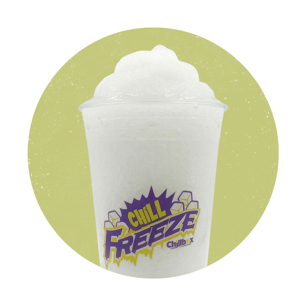 White frozen drink in a clear cup with a purple 