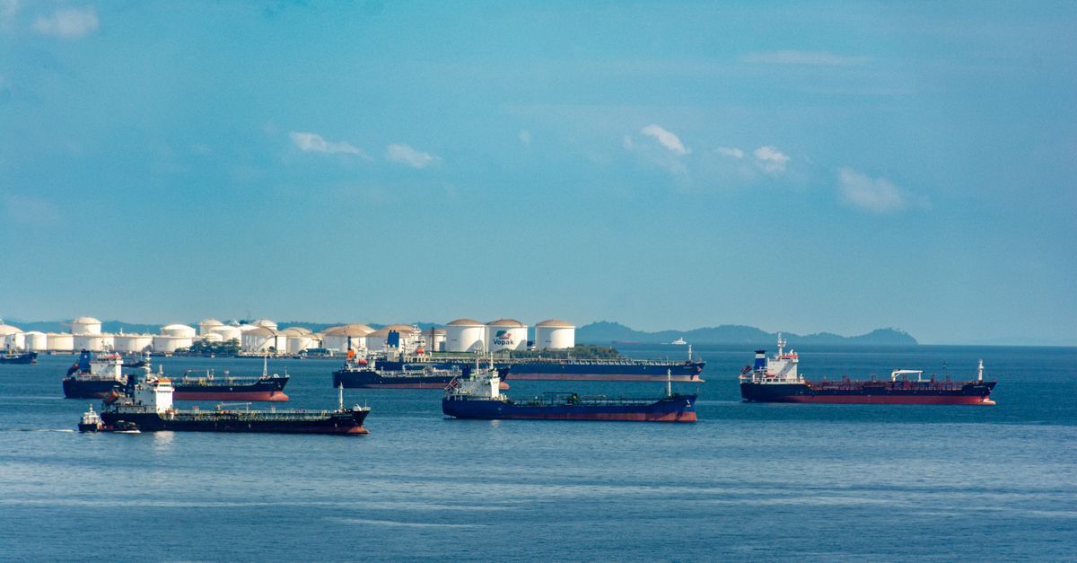 Crude oil tanker ship at sea at sunset