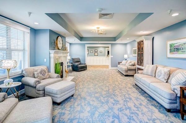 A living room filled with furniture and a fireplace.