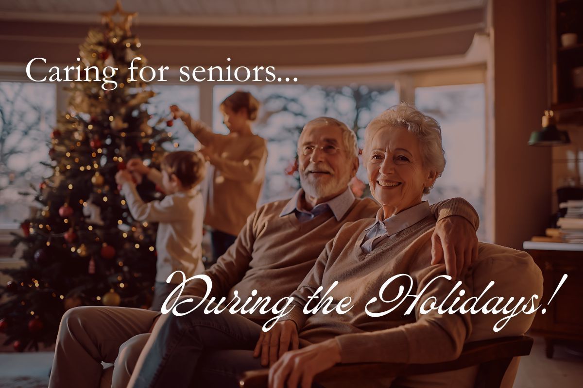 Senior couple smiling, with family decorating Christmas tree in the background. 