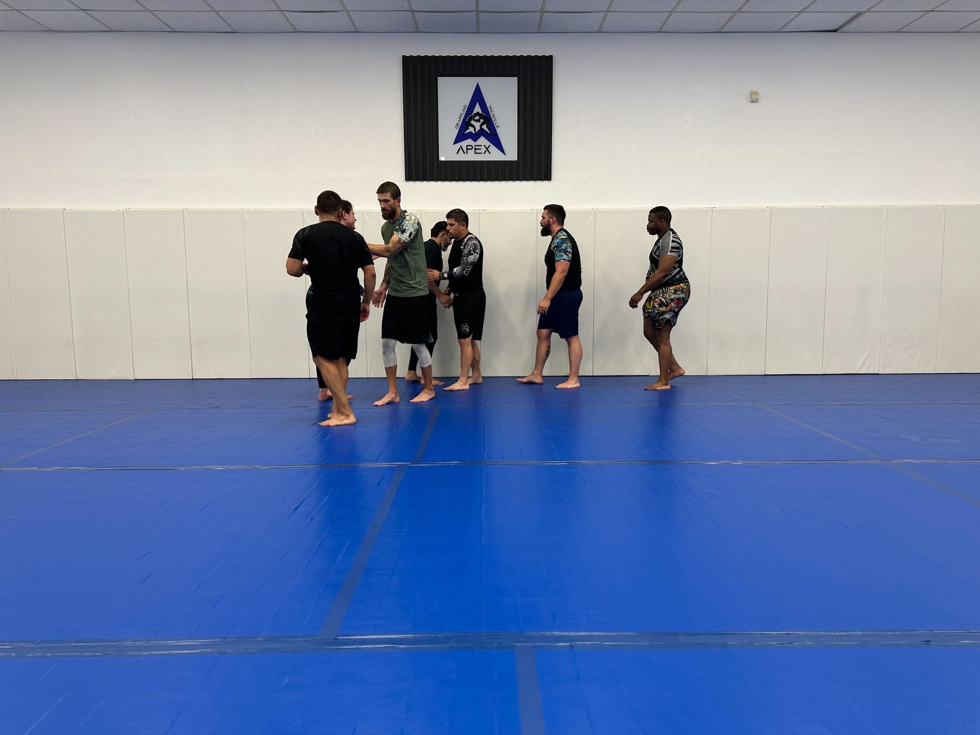 Adults drilling grappling technique at Vacaville Grappling Academy in Vacaville, CA for functional fitness and focus