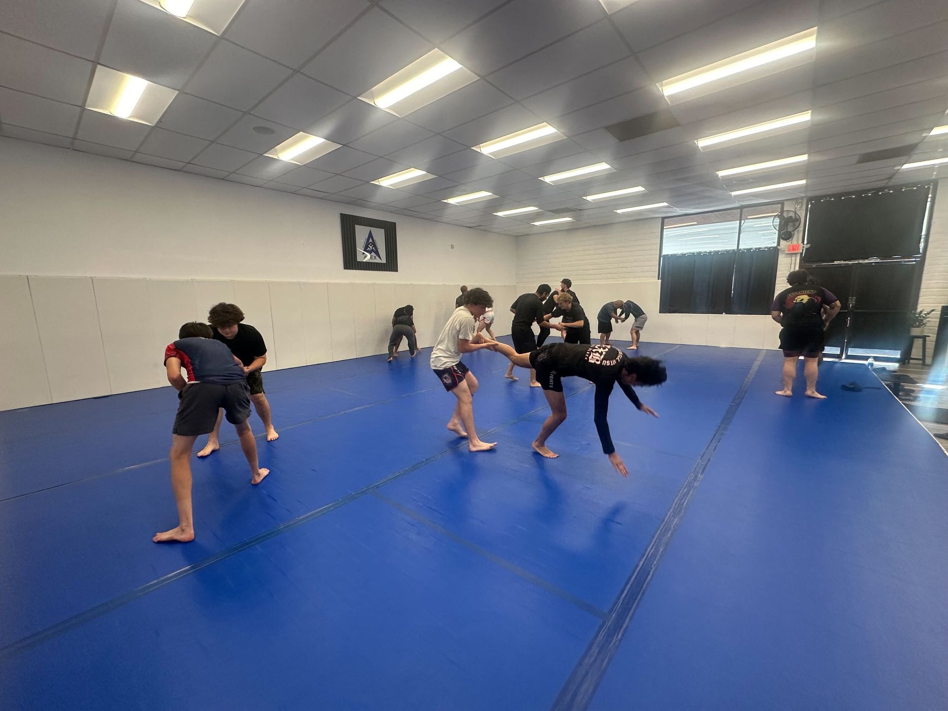 Adults drilling grappling fundamentals at Vacaville Grappling Academy in Vacaville, CA for safe strength and confidence.