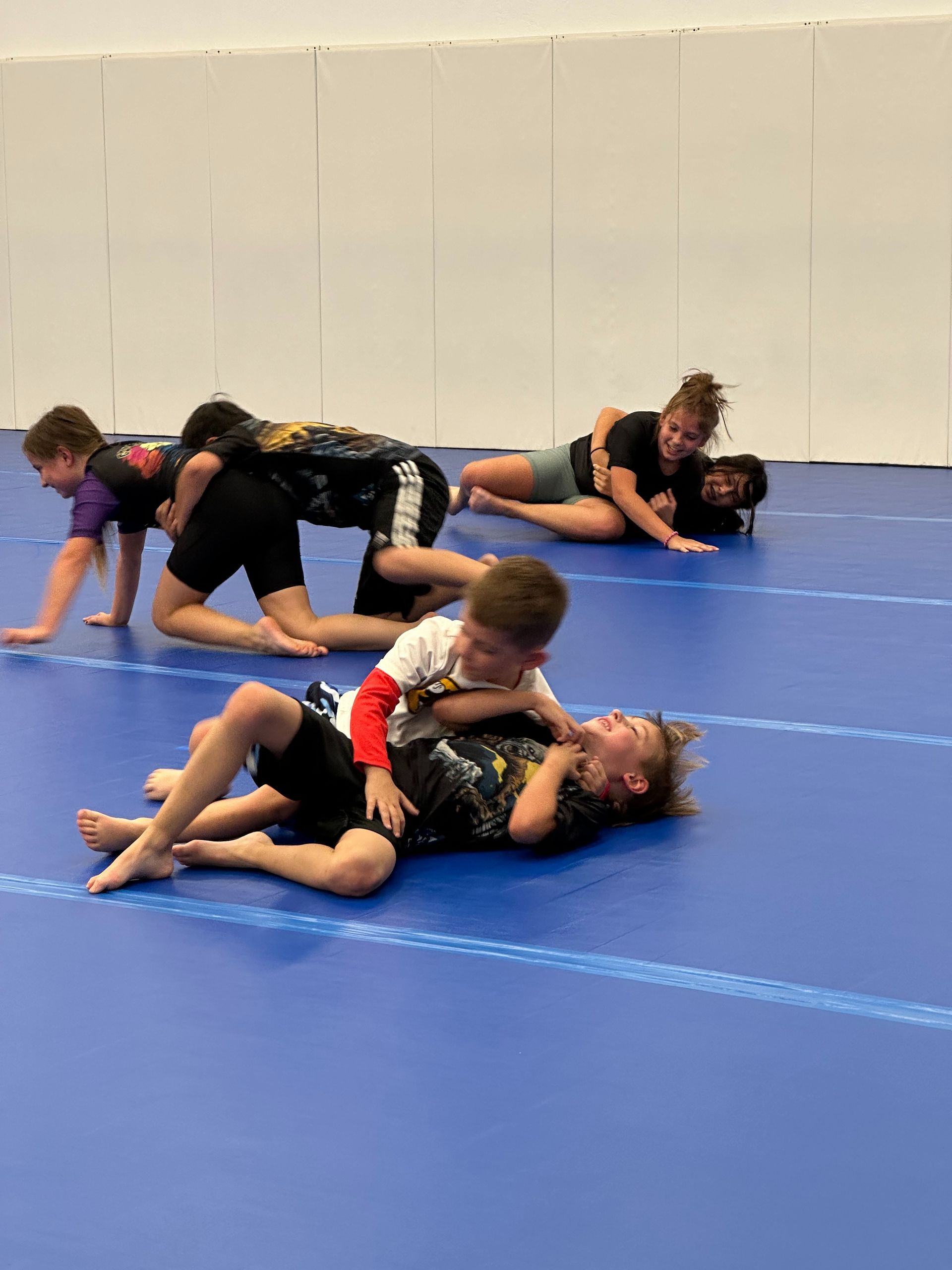 Kids practicing grappling drills at Vacaville Grappling Academy in Vacaville, CA to build confidence and focus