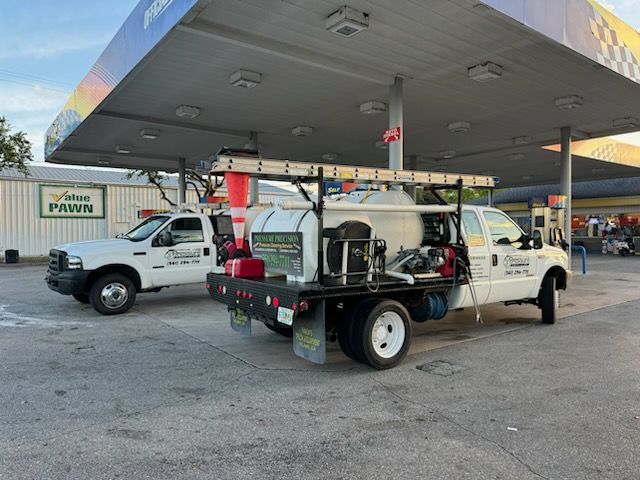 Two white work trucks with the 