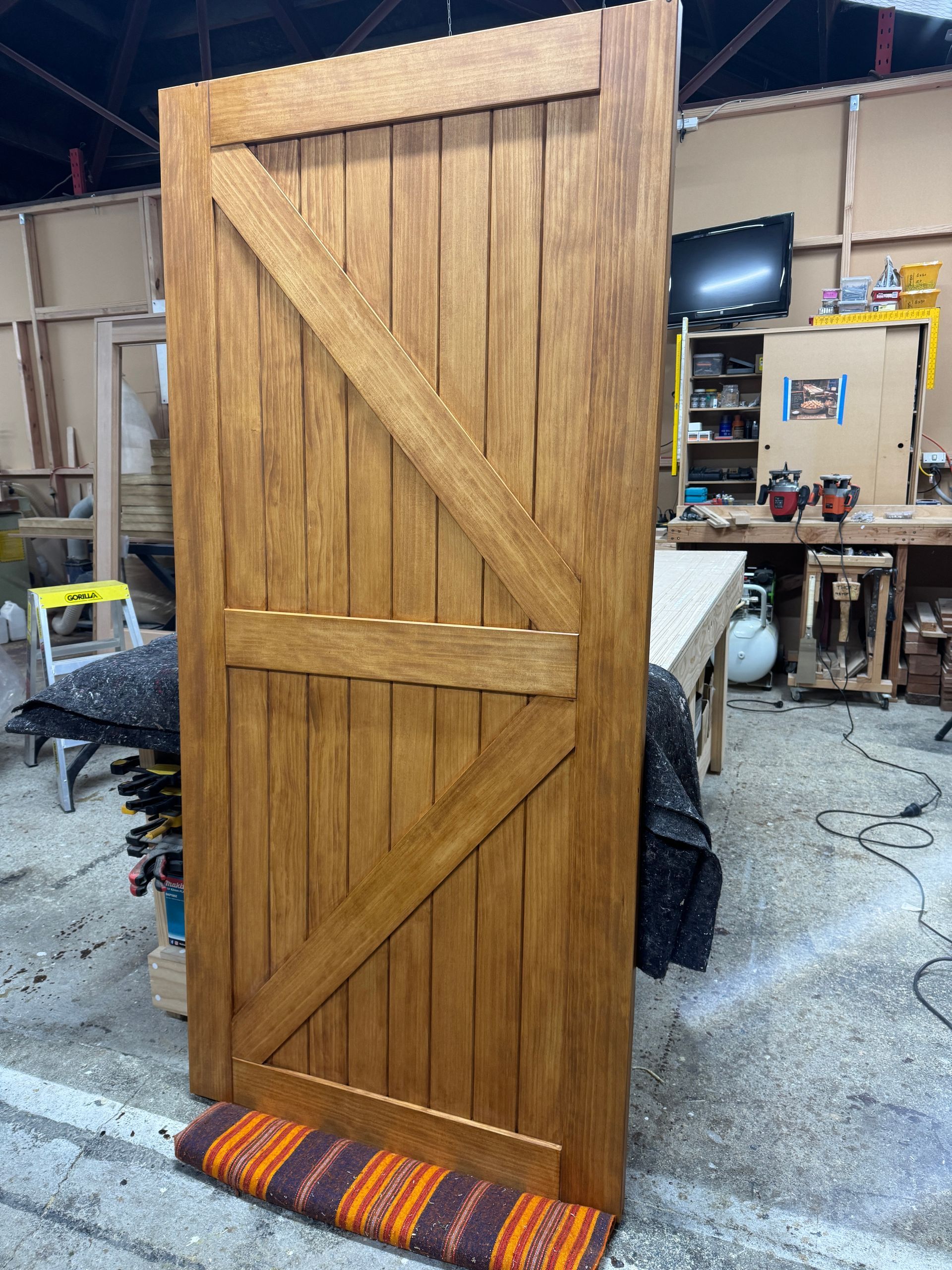 Arrow style barn door with Rimu stain