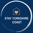 A logo for stay yorkshire coast with a house and a heart in a circle.