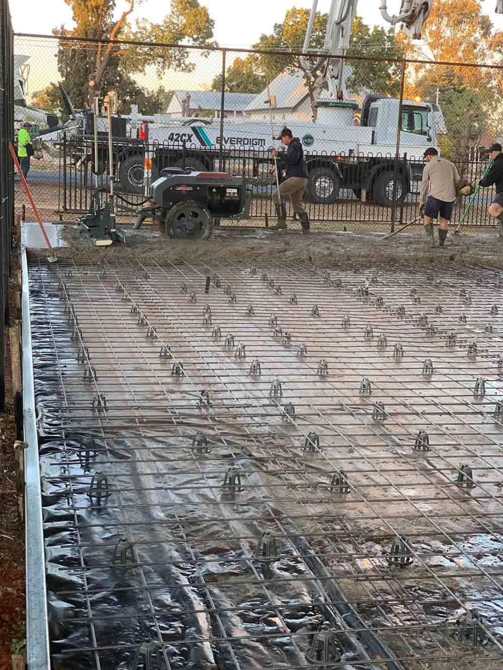 Construction worker concrete ouring - Concreting in Dubbo, Central West	