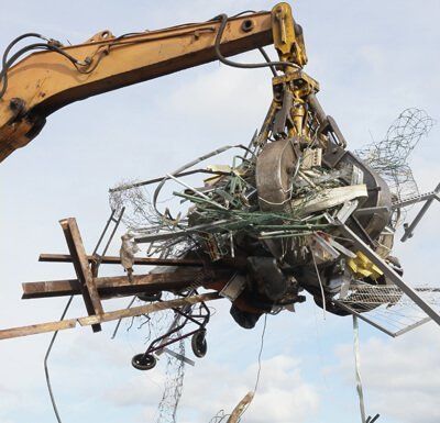 Grab crane removing waste