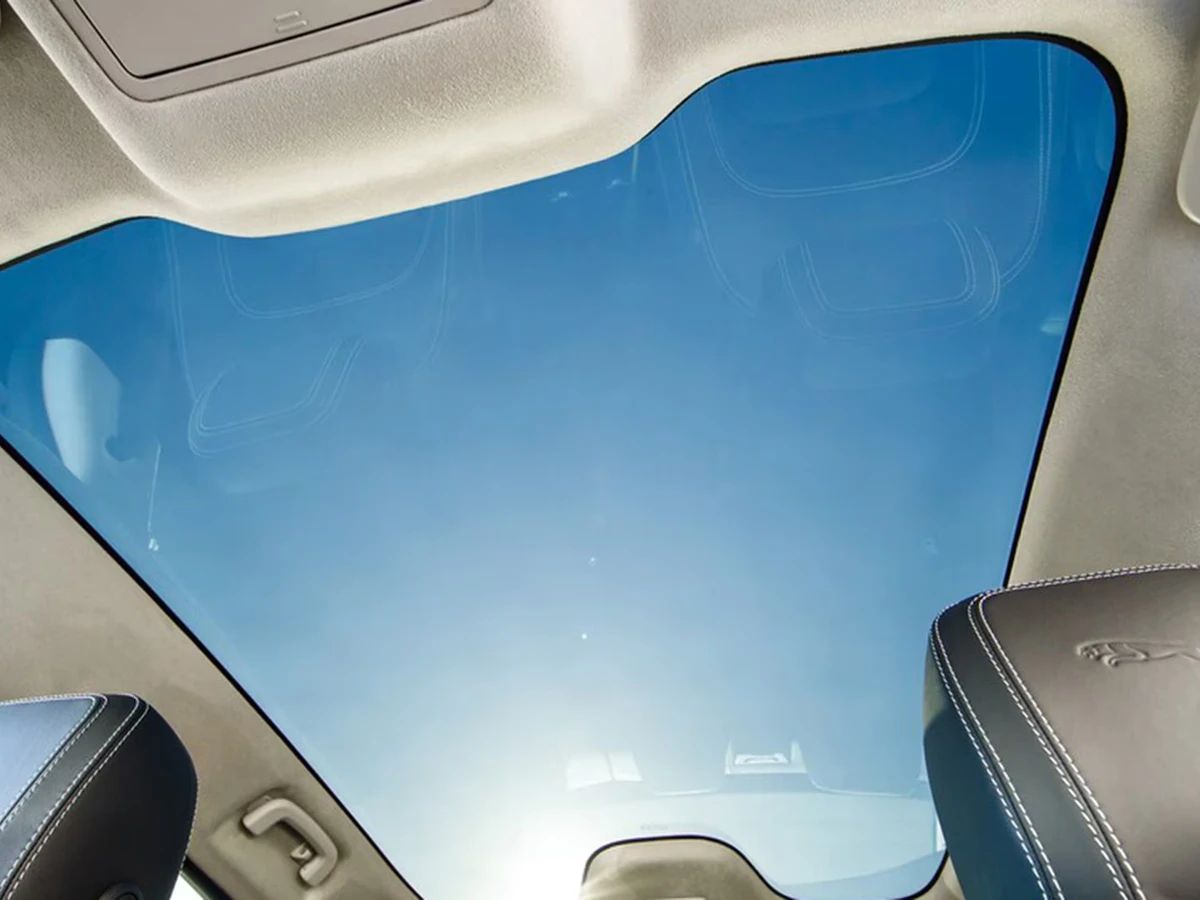 Blue-tinted car sunroof seen from inside the vehicle.
