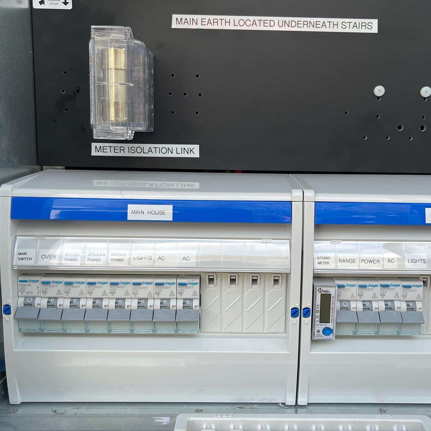 A Bunch of Electrical Boxes Are Sitting on Top of Each Other — Higgins Electrical in Narangba, QLD