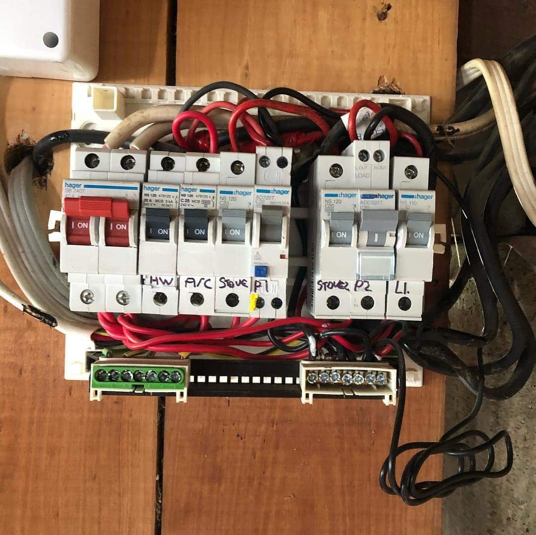 A Bunch of Wires Are Connected to A Switch Board — Higgins Electrical in Nambour, QLD
