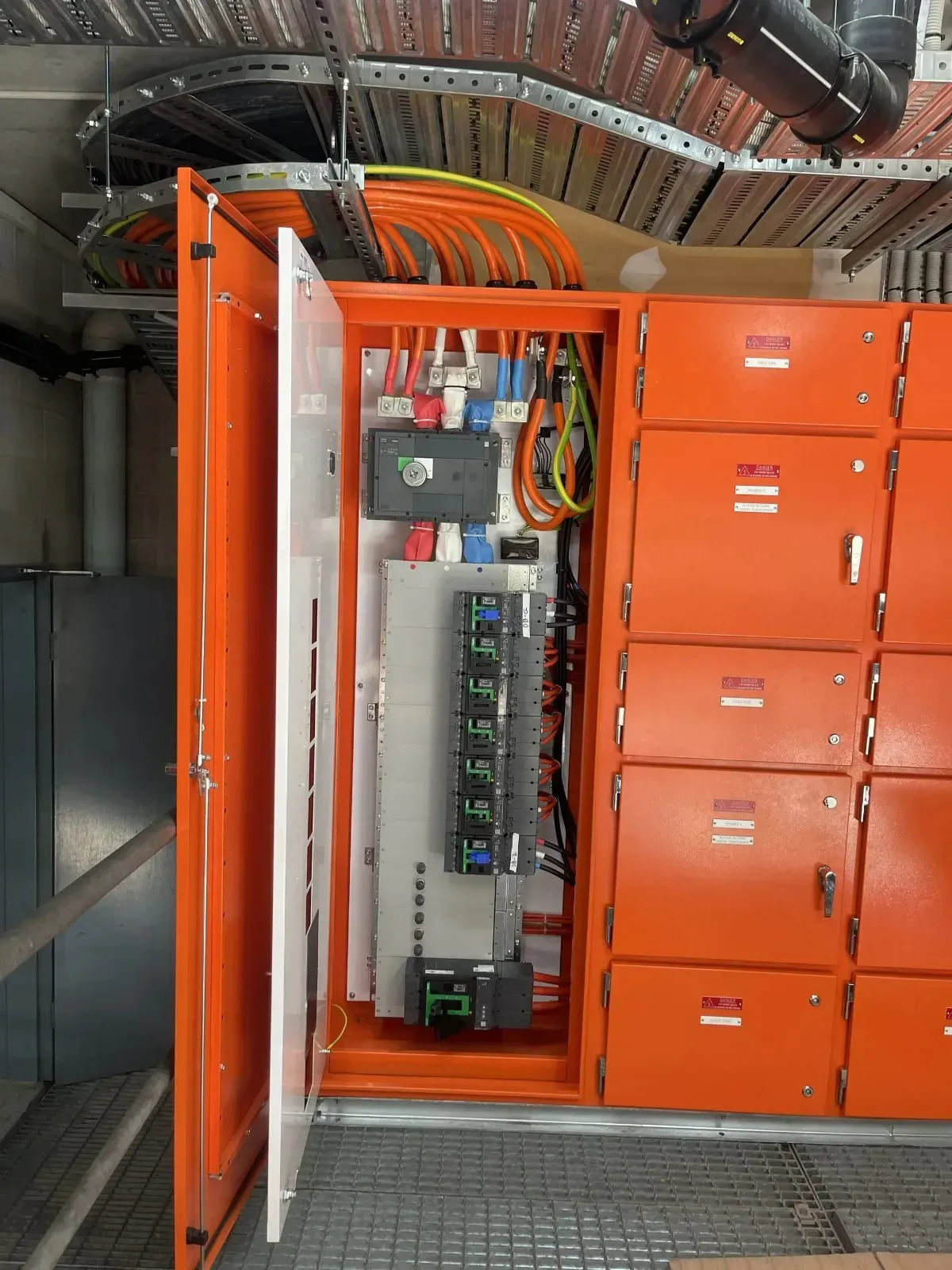 Orange Electrical Panel Cabinet With Open Door Revealing — Higgins Electrical in Narangba, QLD