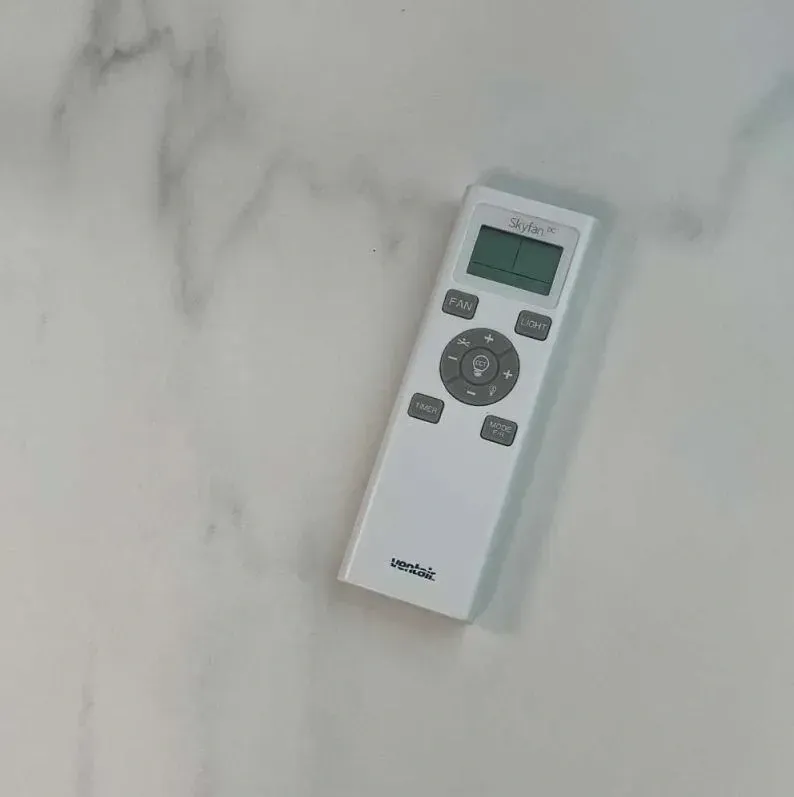 White Remote Control With Buttons and a Display Screen — Higgins Electrical in Caboolture, QLD
