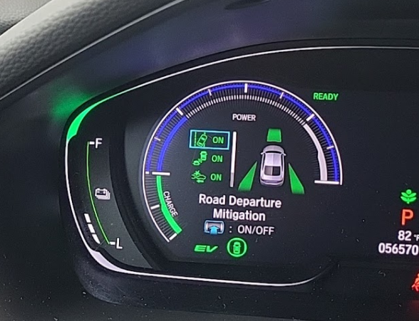 A close up of a car dashboard that says road departure mitigation | Quantum Calibrations