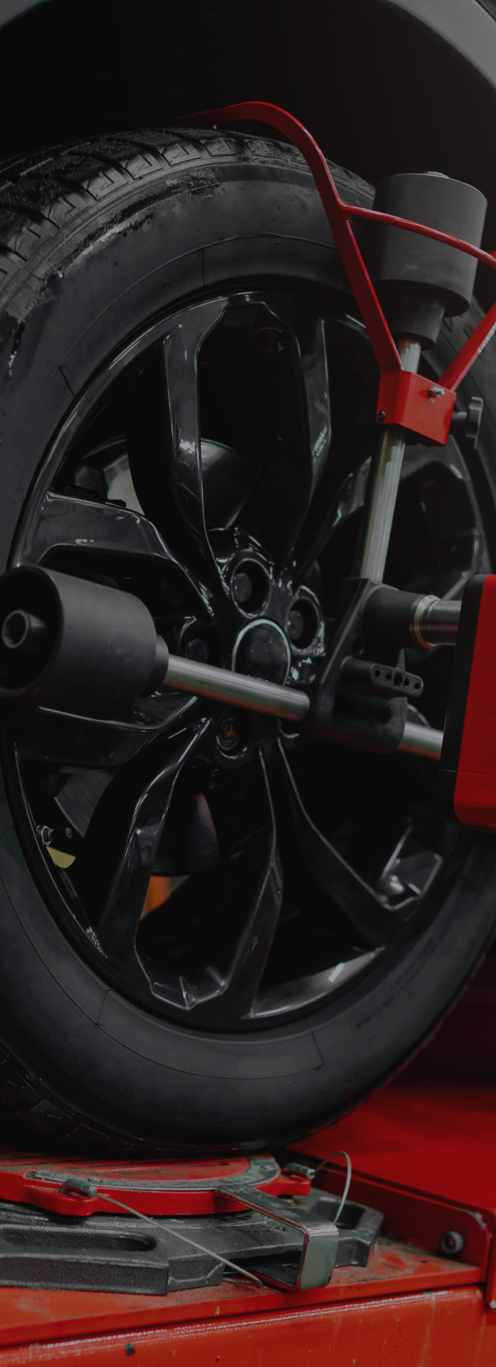 A close up of a tire being balanced on a machine | Quantum Calibrations