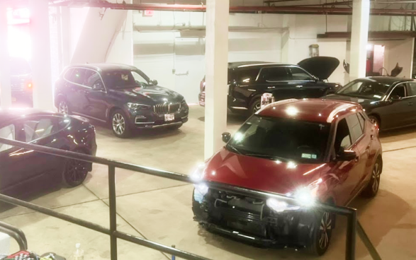 A row of cars are parked in a garage | Quantum Calibrations