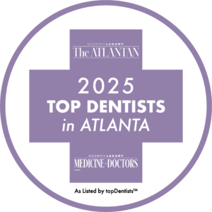 Purple award badge reading “2025 Top Dentists in Atlanta” from The Atlanta and Medicine-Doctors.