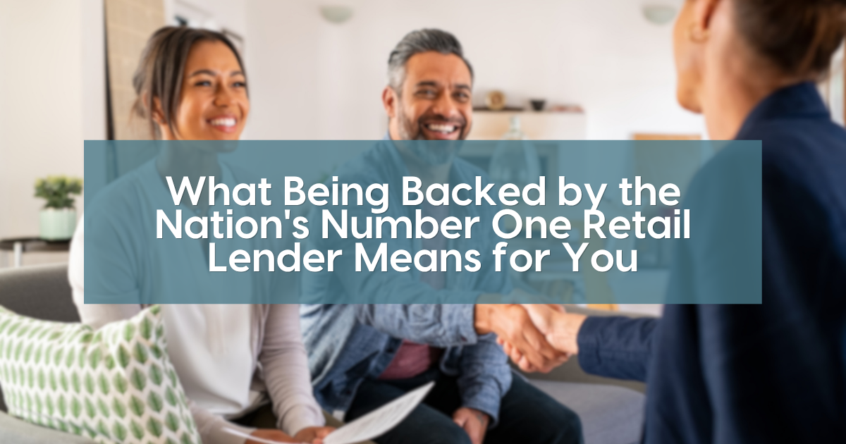 Smiling couple shaking hands with a loan officer during a mortgage meeting in a bright room