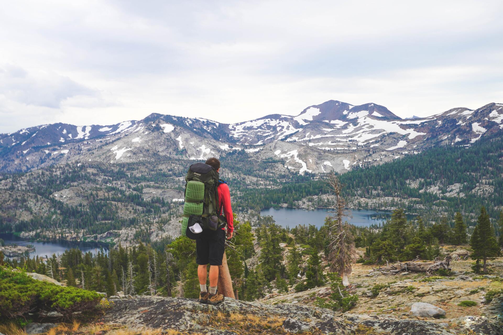 Man standing on top of Lake Tahoe hike